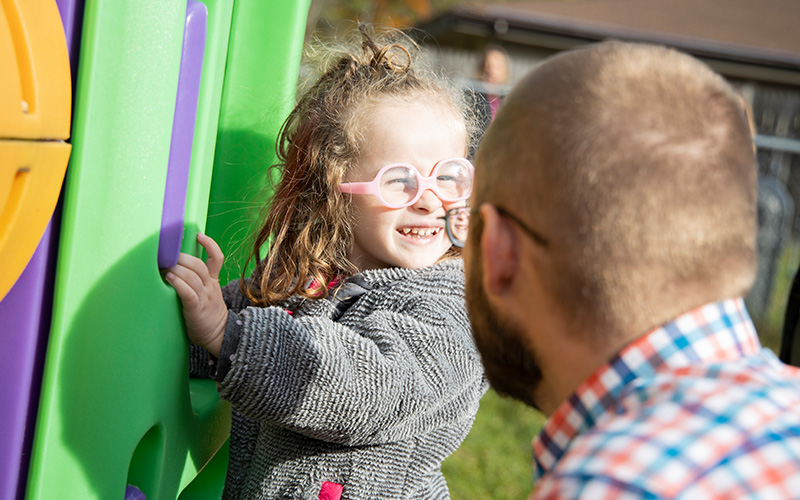 Child and Parent Playing at playground