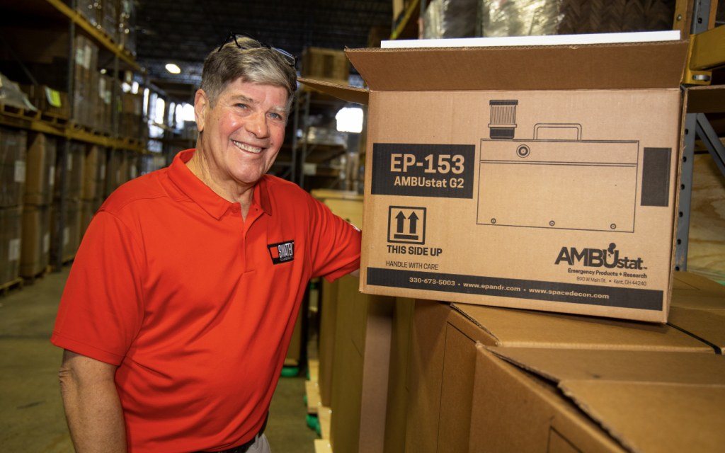 Viking Packaging Employee in Warehouse Displaying Package
